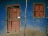 Faded Blue and Red Paint Cover the Entrance to a Dwelling in Addis Ababa