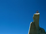Mountain Climbers Raise Their Hands in Celebration after Reaching the Apex of This Moutain Cliff