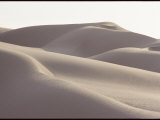 Several Sand Dunes Appear to Rise Like Giant Waves
