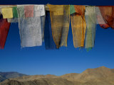 A Line of Multi-Colored Prayer Flags Sway in the Gentle Breeze in Ladakh