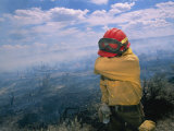 A Fire-Fighter Wipes His Smoke-Irritated Eyes
