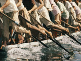 Men Paddle a Boat During a Race on Inle Lake