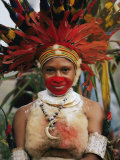 A Tribal Woman Decorated with Beads  Feathers  and Cowries