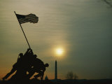 Silhouetted View of the Iwo Jima Memorial with the Capitol and Washington Monument Behind