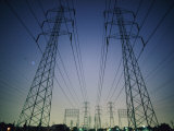 Setting Sun Silhouettes Tall  High-Tension-Wire Towers