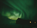The Aurora Borealis Glows Above a Small Cabin in Churchill