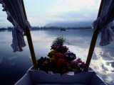 Flowers Decorate the Back End of a Small Boat