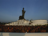Monks Gather at a Statue of Buddha for a Kings Birthday Celebration