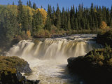 A Time Exposure of a Waterfall Cascading by a Forest During Autumn