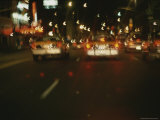 Cars on a Busy New York Street at Night