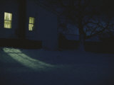 Golden Light Flows out of a Window on a Winter Night