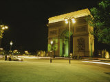Traffic Whizzes Past Pariss Arc De Triomphe at Night
