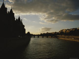 Silhouetted Buildings Along the Seine River at Dusk