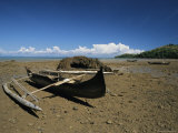 An Outrigger Canoe Sits on a Deserted Beach