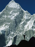 A Climber Silhouetted against Mountains in the Karakoram Range
