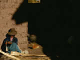 A Peruvian Woman Spins Wool into Thread on a Spool