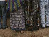 Maya Indians Dressed in Jeans and Traditional Patterned Clothing