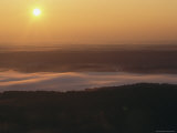 Sunrise over a Fog-Shrouded Valley