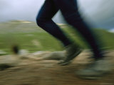 A Hiker Runs on a Ben Nevis Trail