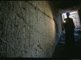 A Man Illuminates a Relief at the Entrance to Ramses Iis Tomb
