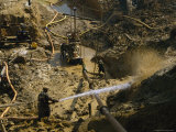 Gold Miners Blast Muddy Holes in the Earth with Water