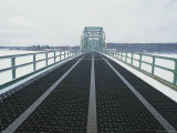 A Bridge Leading Across Snow-Covered Ice