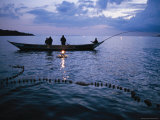 Ugandan Men Using Nets and Lanterns to Catch Small Fish for Pet Food