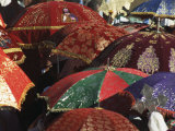 Brightly Colored Umbrellas and Robes Liven an Epiphany Procession
