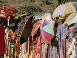 Brightly Colored Umbrellas and Robes Liven an Epiphany Procession