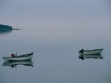 Two Boats Sitting in Glass Smooth Water