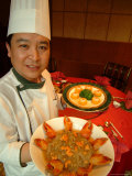 A Chef at the St Regis Hotel Displays Plates of Chinese Cuisine