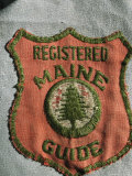 A Patch on the Uniform of a Registered Maine Guide
