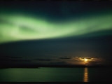 Auroral Curtain Over Water at Sunset