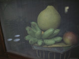 A Pomelo  Green Bananas  and Apple Rest in the Window of a Small Shop