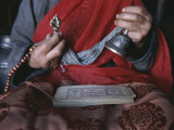 Buddhist Lama with Prayer Book  Prayer Beads and Dorge