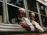 Indian Tourists Stare Out of the Window of a Tourist Bus in Agra; the Bus is Near the Taj Mahal