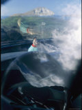 A View Inside a Car with a Hawaiian Hula Dancer on the Dashboard