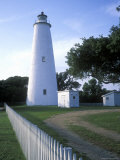 The Lighthouse Stands Behind a Fence on Ocracoke Island