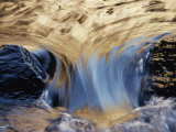 Water Flows Swiftly Between Two Rocks