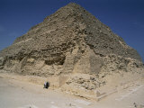 Two American Tourists Reach out to Touch the Ancient Stone of the Step Pyramid