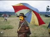 A Huli Warrior Takes Advantage of an Umbrella to Keep Himself Dry