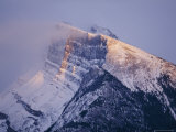 A Wind-Blown Peak Juts Forth Revealing Sedimentary Lines in its Stone Face