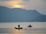 Two Fisherman Tending to Their Nets