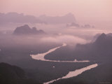 Mist Rises over a River in Thailand