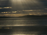 Sunlight Pierces the Clouds over the Coast of Tasmania