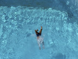 A Swimmer Dives into a Swimming Pool