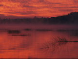 Red-Orange Sky Reflected in Lake Water