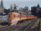 A Train on the Tracks with the Chicago Skyline in the Background