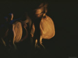 A Pair of Dancers Swirl Fabric as They Twirl About