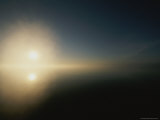 The Sun Casts a Reflection on the Water as it Sets